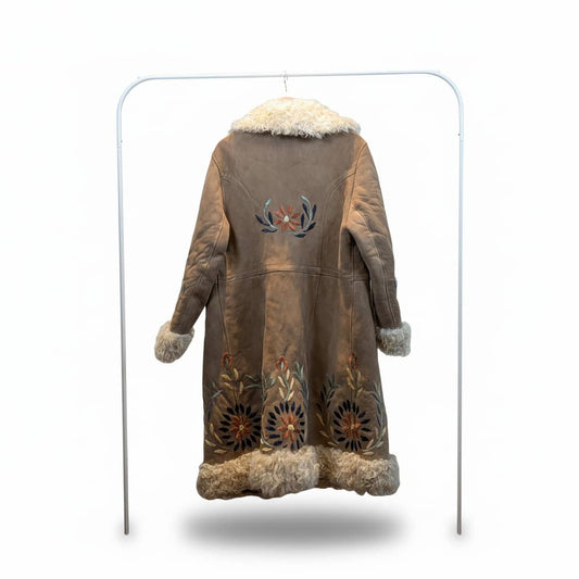 Brown leather coat with fur trim and floral embroidery on a white background