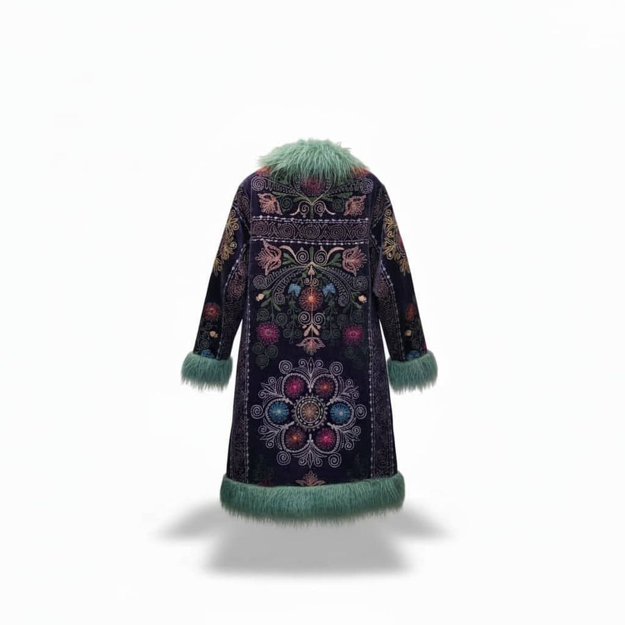 Decorative coat with intricate patterns and green fur trim on a white background