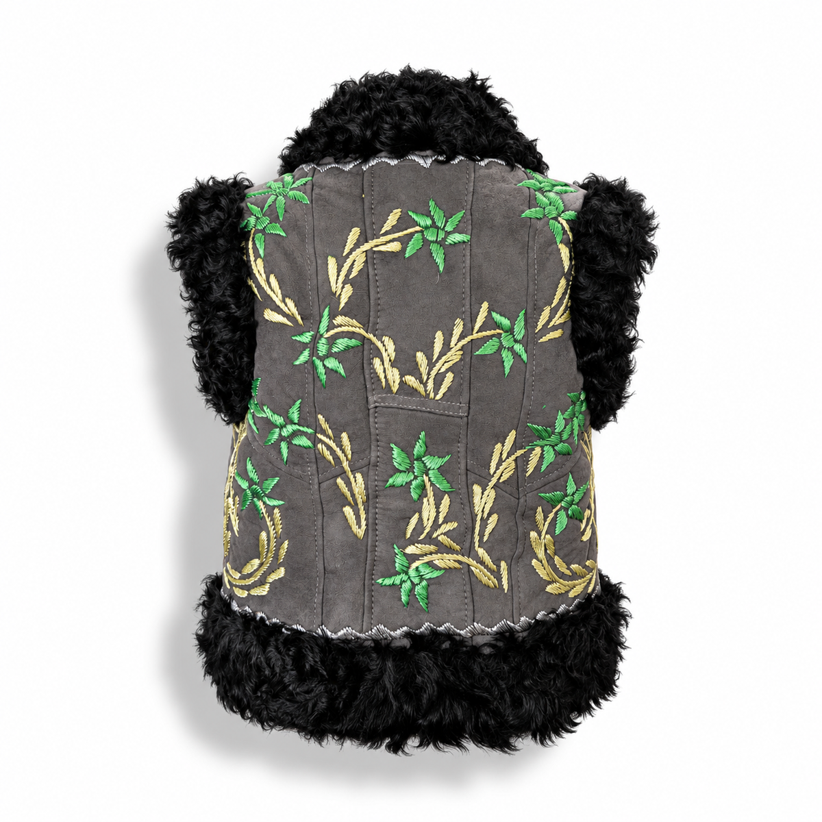 Back view of a charcoal grey suede vest with black curly shearling trim on the collar and hem, featuring gold and green embroidered floral vine patterns.