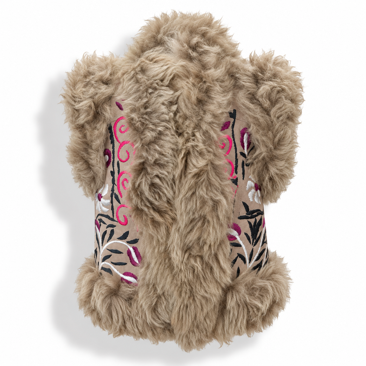 A fluffy faux-fur vest in a light tan/beige color, featuring embroidered floral and swirl patterns in pink, black, and white on the sides, shown against a plain white background.