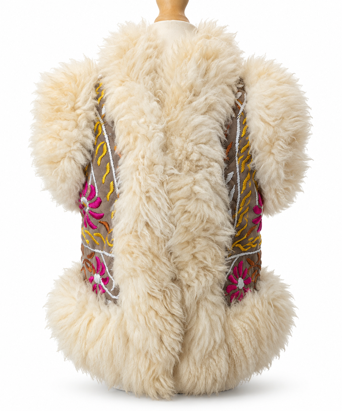 A cream-colored sheepskin vest with colorful embroidered floral details on the sides, displayed on a mannequin against a white background.