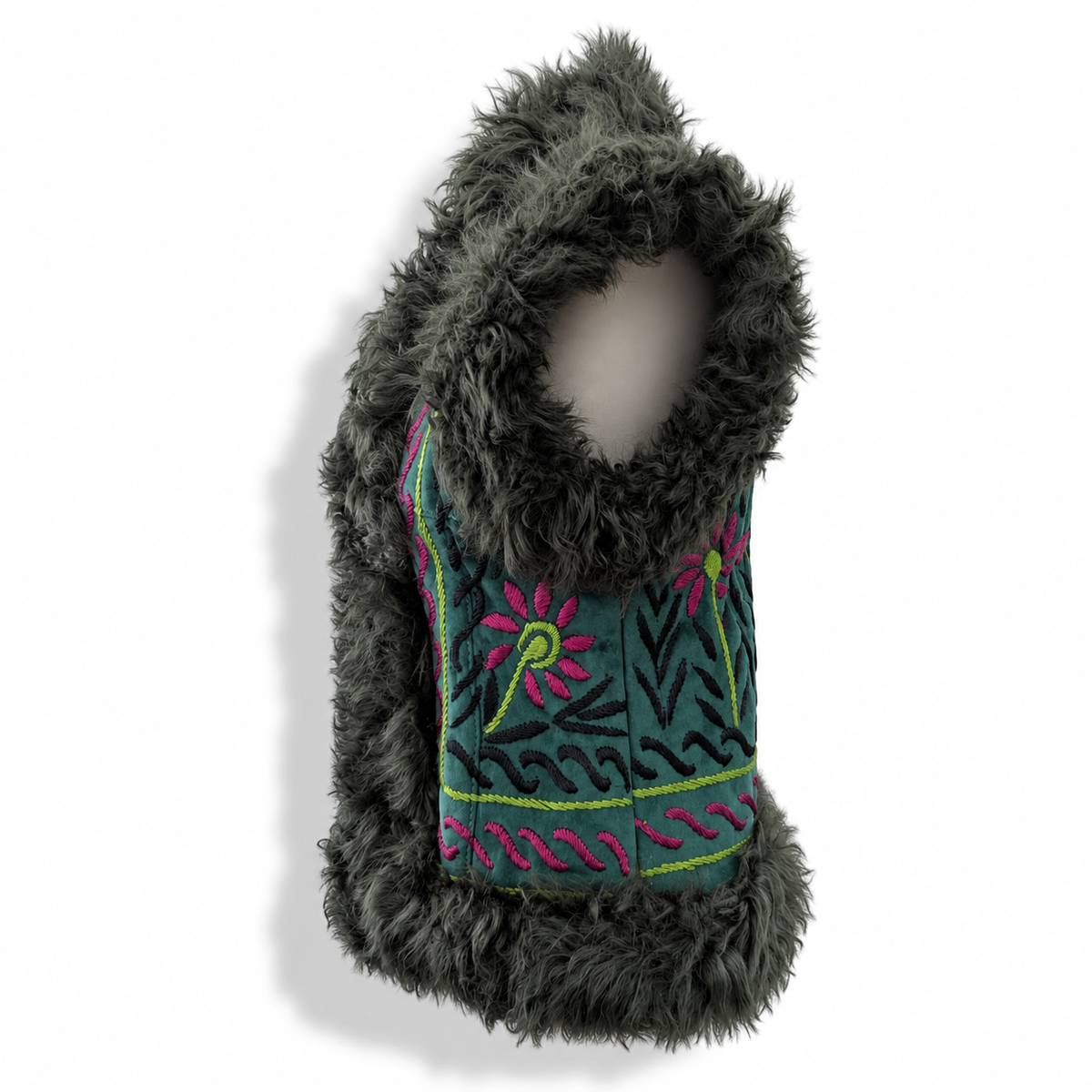 Front view of a teal suede vest with a dark gray shaggy shearling hood and trim, featuring a colorful embroidered panel with pink flowers and green leaves, displayed on a mannequin torso against a white background.