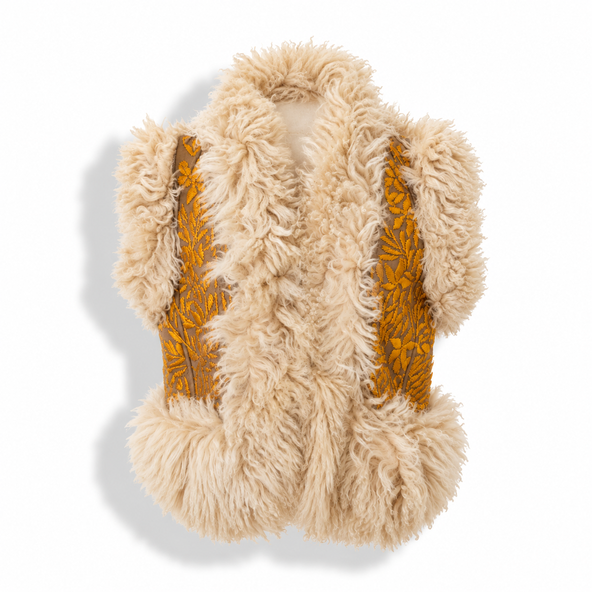 A sleeveless beige faux fur vest with mustard yellow embroidered leaf patterns on the sides, shown against a white background with a soft shadow.